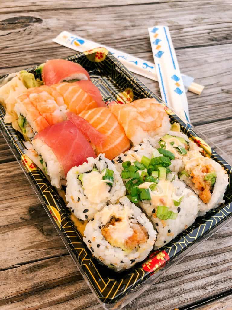 Spicy salmon and Rainbow sushi roll take out