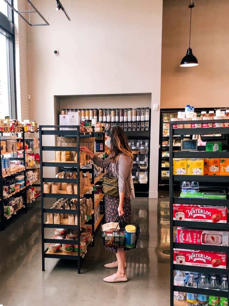 woman in mask grocery shopping